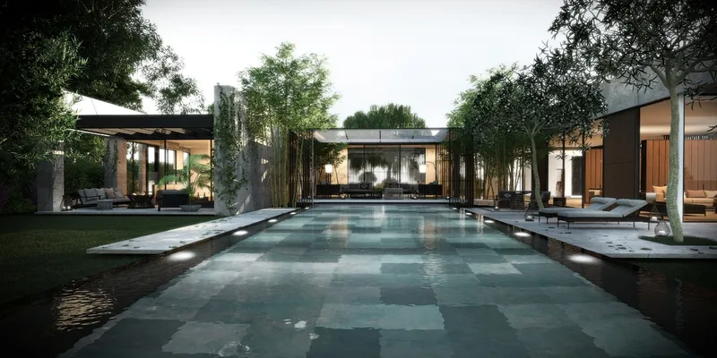 Swimming pool alongside the building and its outdoor spaces.