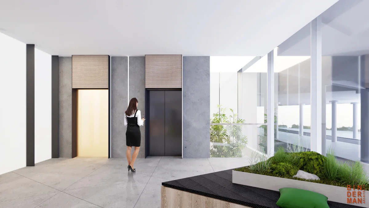 Lift lobby showing lift doors and the surrounding wall and floor finishes.