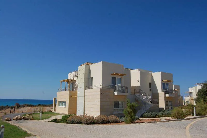Exterior view of a multi-storey building with windows and balconies.