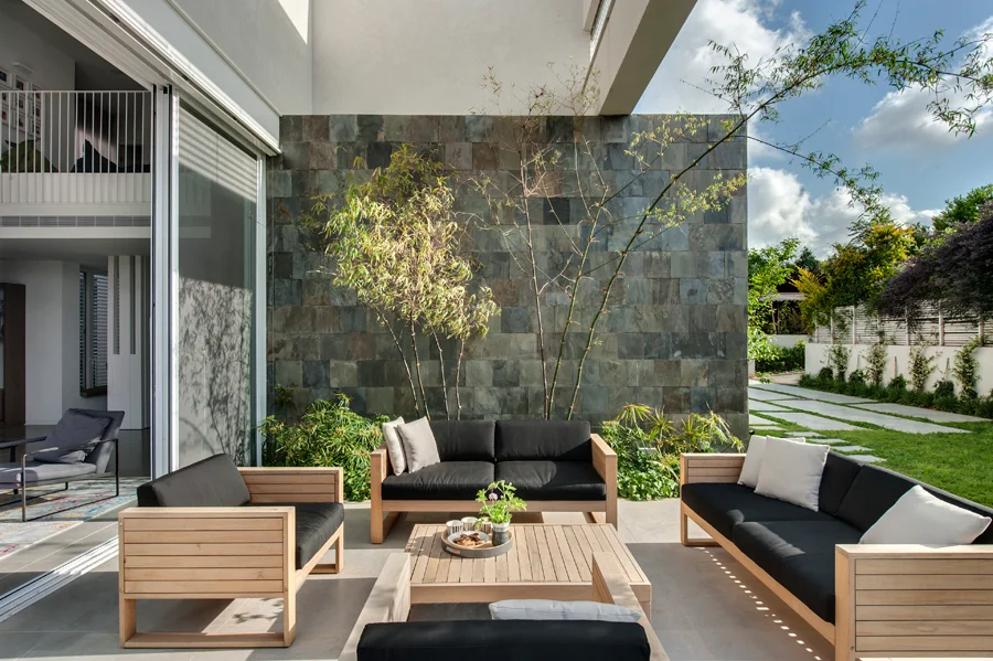 Outdoor seating area beside the building's glazed openings.