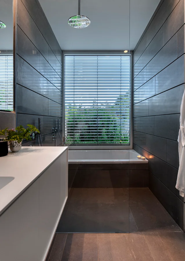 Shower area showing its enclosure and surrounding finishes.