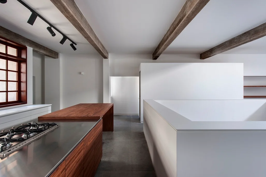 Kitchen showing its counters, cabinetry and working area.