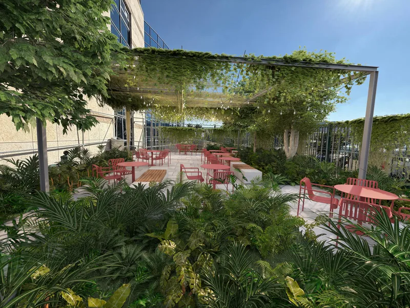 Outdoor seating area beside the building's glazed openings.