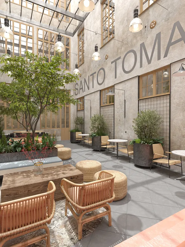 Outdoor seating area beside the building's glazed openings.