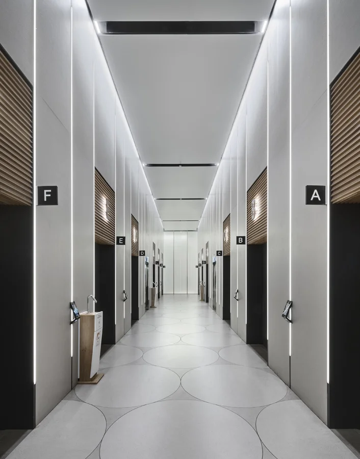 Lift lobby showing lift doors and the surrounding wall and floor finishes.