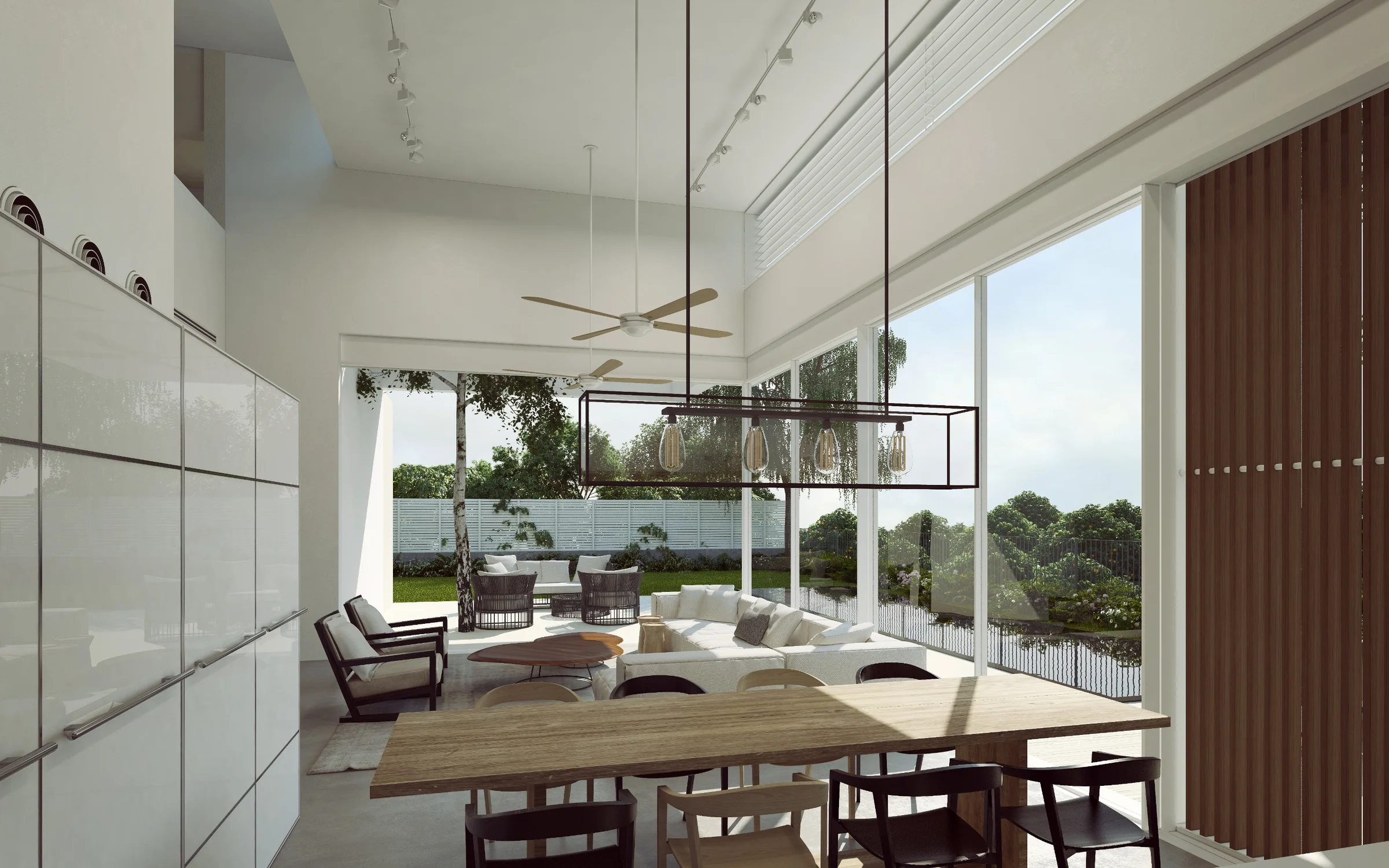 Dining space showing the table, chairs and overhead lighting.