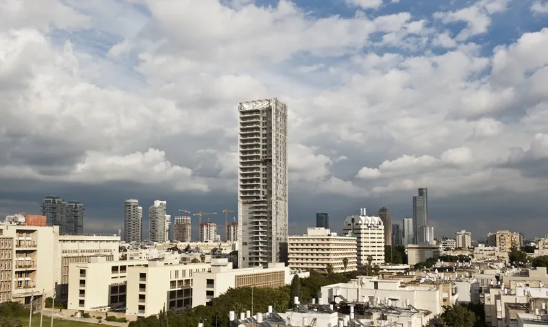 Overview of buildings, streets and landscaped outdoor spaces.