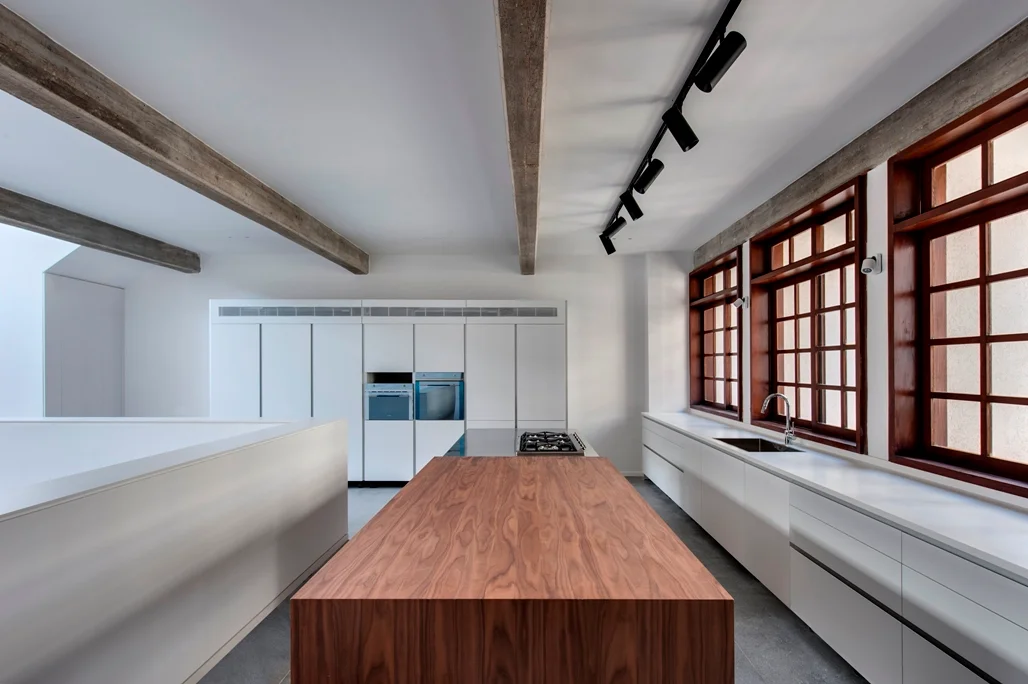 Kitchen showing its counters, cabinetry and working area.