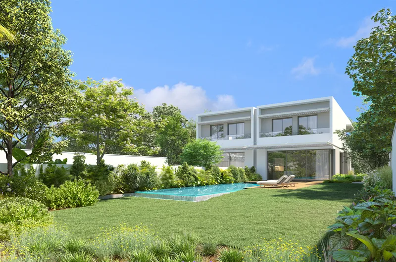 House and glazed living space opening onto a planted lawn.