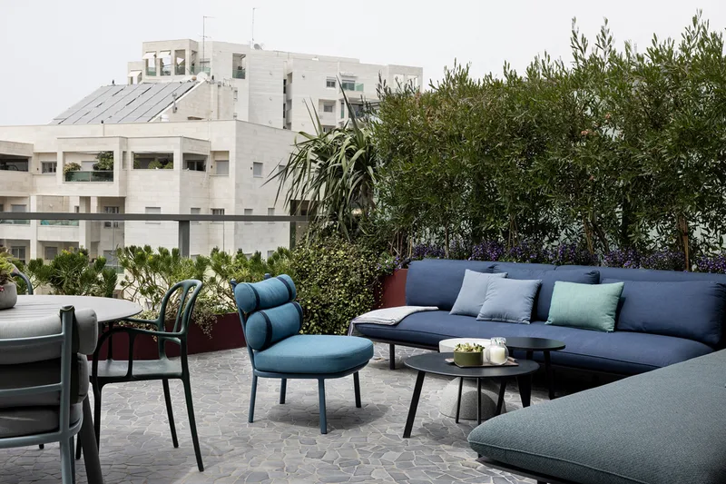 Balcony with outdoor seating overlooking the surroundings.