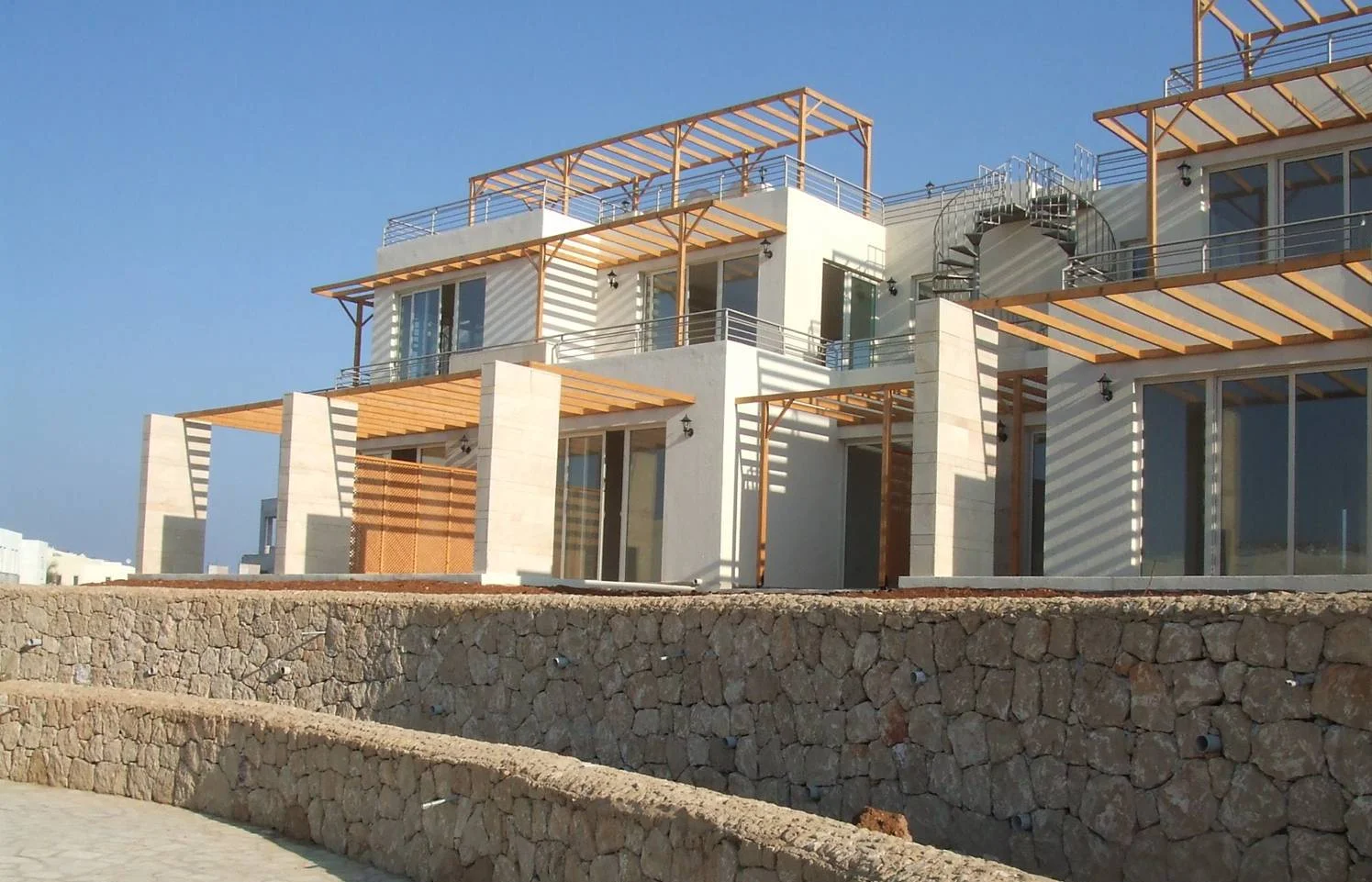 Exterior view of a multi-storey building with windows and balconies.