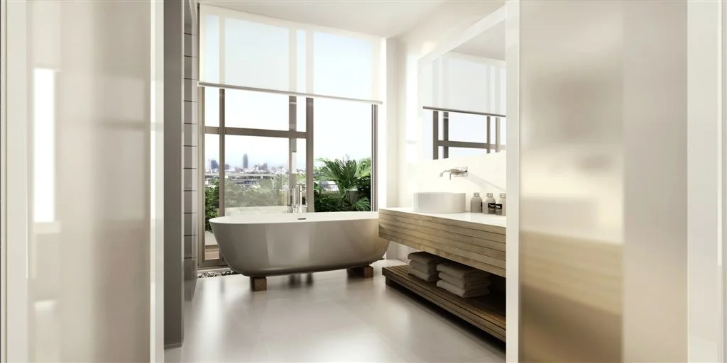 Bathroom showing a bathtub and surrounding wall and floor finishes.