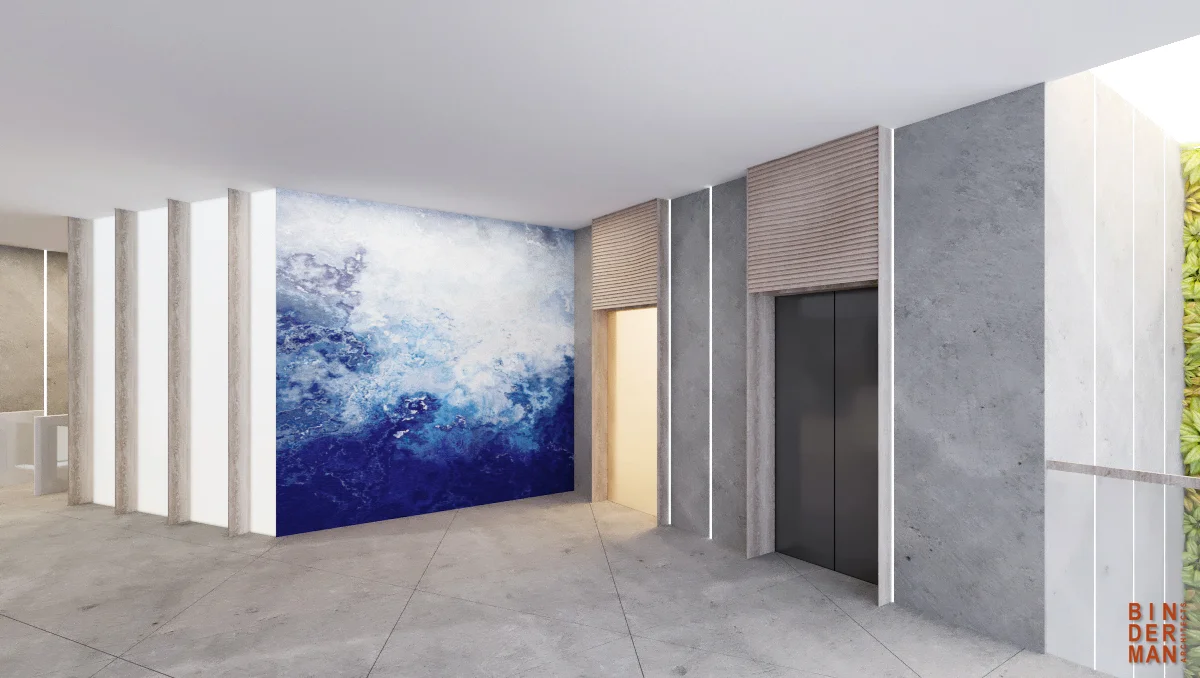 Lift lobby showing lift doors and the surrounding wall and floor finishes.