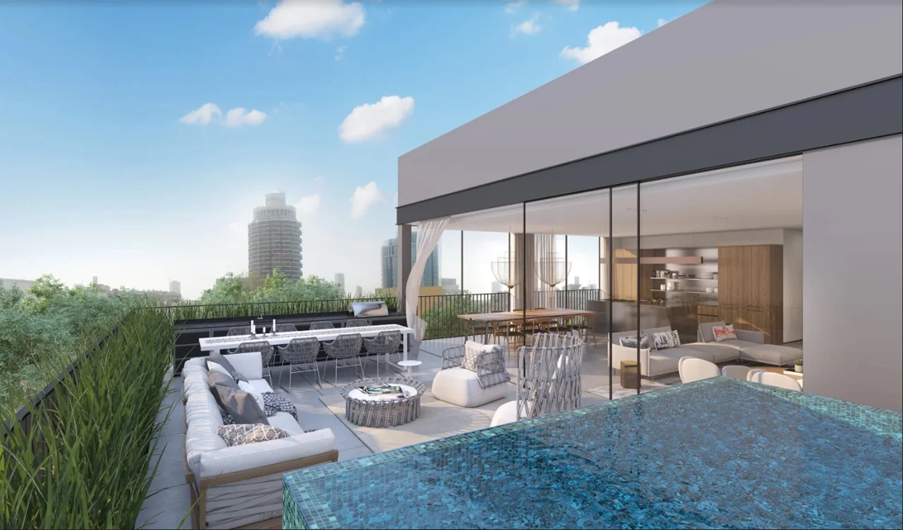 Swimming pool alongside the building and its outdoor spaces.