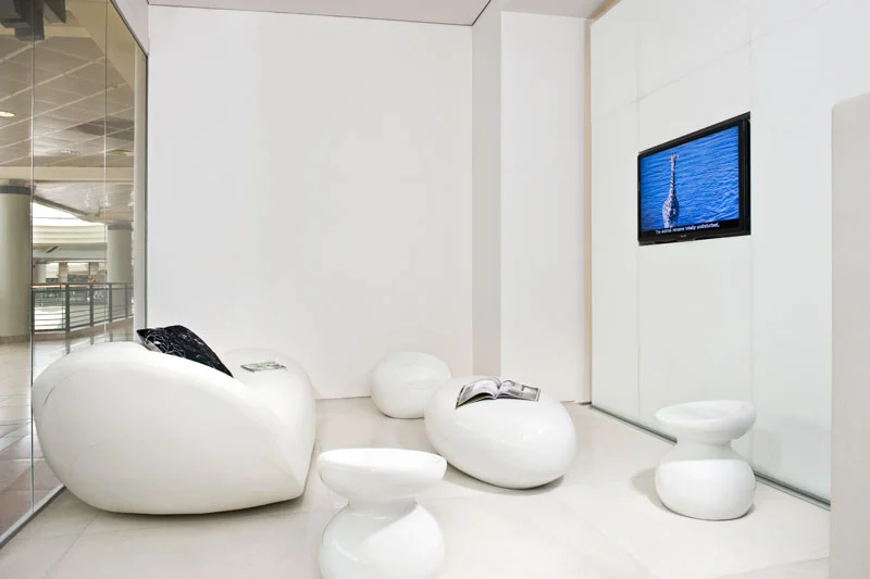 Close view of seating and tables within the interior.