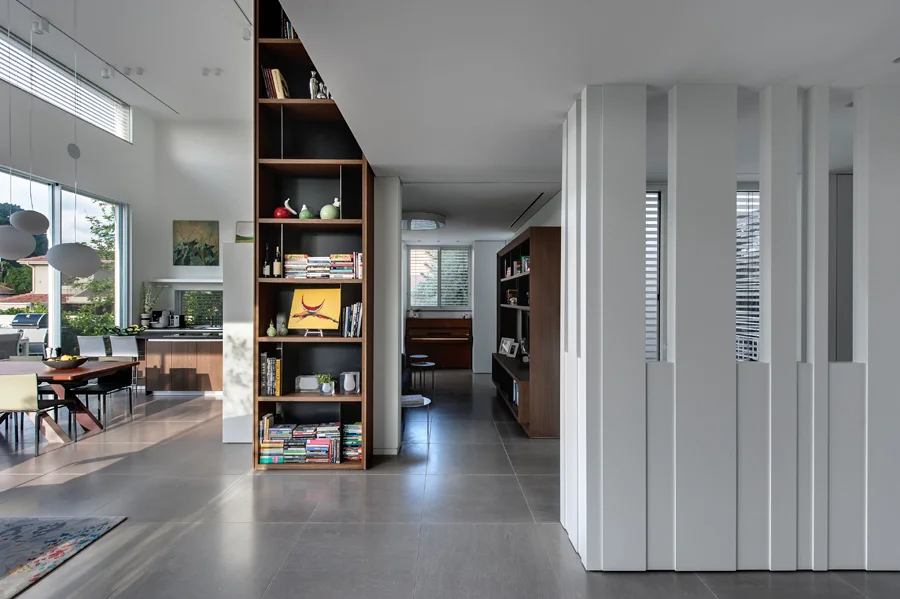 Interior featuring full-height bookshelves.